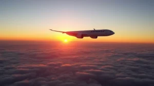 Air France Boeing 777 aircraft in flight over ocean during golden hour sunset, clouds below, realistic photography