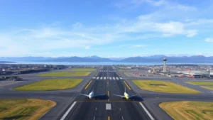 Aerial view of Seattle-Tacoma International Airport runway with Puget Sound mountains in background, professional wide-angle photography, daytime